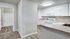 Spacious apartment with carpet and plank flooring and large windows