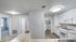 Spacious apartment with carpet and plank flooring and large windows