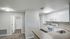 Spacious apartment with carpet and plank flooring and large windows