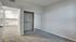 Carpeted bedroom with closet