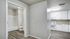 Spacious apartment with carpet and plank flooring and large windows
