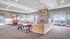 Resident clubhouse with seating, a TV area, and community kitchen