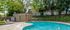 Scenic pool at La Loma Terrace Apartments with lounge chairs