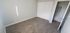 An inviting room featuring carpeted flooring and pristine white doors in Sierra Oaks
