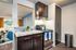 Kitchen counters, stove, and full height pantry with Pass-Through Window