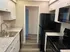white shaker cabinets doors with black appliances in kitchen