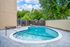Sparking pool with beautiful big green trees behind the fence line