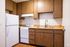 Kitchen with stainless steel sink, white appliances