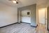 open bedroom with closet and shelving
