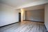 vinyl flooring in living area white black baseboards and white walls