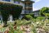 rosebushes outside the building with water fountain creating a little oasis