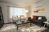 A cozy living room featuring a comfortable couch, a stylish coffee table, and a television for entertainment.