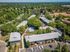 ariel view of community surrounded by trees