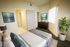 Staged bedroom connecting to bathroom