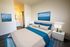 Staged bedroom connecting to bathroom