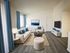 Staged living room with large windows