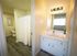 Bathroom with white cabinetry