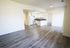 Bright living room with dining area connecting to kitchen