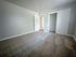 Carpeted bedroom with large closet