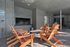 Enjoy the warmth of the fireplace while sitting with friends