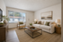 vinyl flooring throughout living room with large wide window next to front door