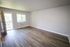 Wood-look flooring in living area with ample natural light