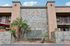 Charming Seashore Apartment Homes with elegant facade, lush greenery, and inviting balconies.