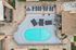 Chic aerial view of modern apartment complex with inviting pool, stylish lounge chairs, and elegant umbrellas, offering a luxurious outdoor retreat.