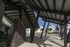Stylish entrance of a contemporary apartment complex with modern architecture and landscaped surroundings.