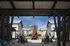 Picturesque courtyard with modern townhouses, outdoor seating, and a central fire pit.