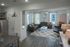 Contemporary living room with sleek furniture, stylish decor, and ample natural light.