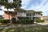 Photo of 2 story building with screened porches.