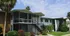 Photo of 2 story building with screened porches.