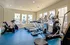 Fitness center showing a stationary bike, recumbent bike, 2 treadmills, 2 elliptical machines, and a stair machine.