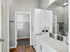 Modern bathroom with sleek vanity and white cabinetry