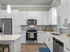 Sleek modern kitchen with stainless steel appliances and white cabinetry