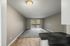 Bright, spacious living area with a large window and modern finishes.