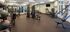 Modern fitness center equipped with advanced exercise machines and weight racks.