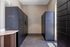 Contemporary apartment package room with secure Luxer One lockers.