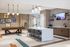 Contemporary community lounge featuring a modern shuffleboard table, stylish bar seating, and a sleek kitchenette.