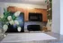Inviting kitchen with stainless steel appliances, warm wooden cabinets, and lush greenery, creating a cozy ambiance.