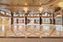 Luxurious grand lobby with ornate ceiling and polished marble flooring, offering a lavish and welcoming entryway.