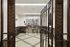 Sophisticated apartment entryway featuring an ornate metal gate and a stunning vault-like door, exuding luxury and security.
