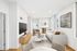 Bright and elegant living room with contemporary furniture, large windows, modern art, and sleek d&eacute;cor, perfect for stylish urban living.