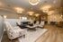 Elegant communal lounge with stylish seating, warm lighting, and a cozy atmosphere, perfect for relaxation and socializing.