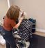 Chic salon scene with a stylist expertly cutting a client's hair, showcasing a modern and inviting atmosphere.