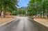 Charming residential neighborhood with cozy homes set amidst lush greenery and tranquil surroundings.