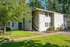 2 story apartment building and lush landscaping at kings meadow