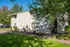 2 story apartment building and lush landscaping at kings meadow