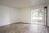 updated living space with sliding glass doors, vinyl plank flooring